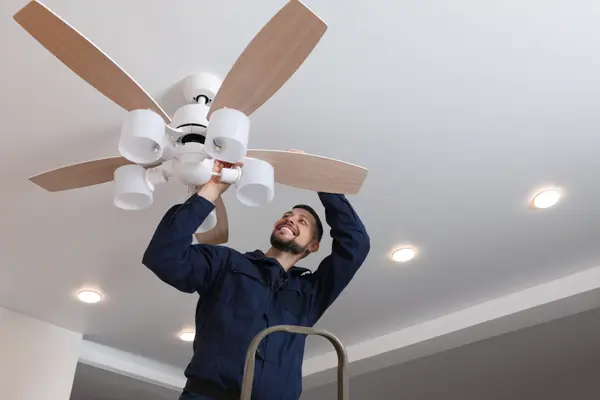 a electrician installing a celing fan from Electrician Richardson TX in Richardson, TX - Electrical ceiling fan installation